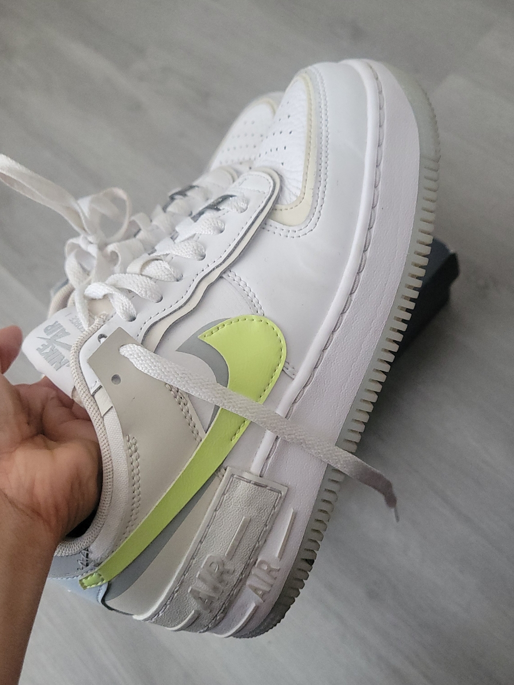 ' White Sneaker with Volt Swoosh